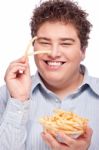 Chubby Man With French Fries Stock Photo