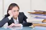 Office Worker In Office With Many Folders Stock Photo