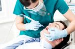 Professional Dentist Doing Teeth Checkup Stock Photo