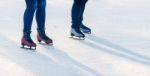 Two Young Girls Are Skating On The Rink Stock Photo