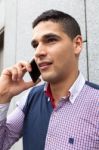 Portrait Of A Young Man With Talking On The Phone Stock Photo