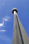 Photo Og The Cn Tower, Blue Sky, Clouds And The Plane Stock Photo