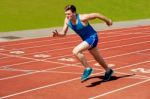 Male Runner On Starting Blocks Stock Photo