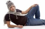 Male Lying And Wearing Woolen Cap Stock Photo