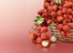 Lychee On Red Solid Background Stock Photo