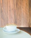 Coffee Latte Cup On Corner Of Wooden Background Stock Photo