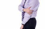 Cropped Image Of Businessman With Elbow Pain Stock Photo