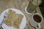 Breakfast Set Of Coffee Drink And Fried Ham Cheese Roti Stock Photo