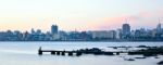 Sunset Scene Of Beach And Skyline At Background In Montevideo, U Stock Photo