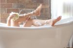 Woman Shower In Bathtub Stock Photo