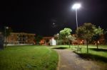 Night Public Park In The City With Houses Near Stock Photo