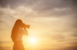 Women Nature Photographer With Digital Camera On The Mountain Stock Photo