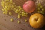 Fruits On Wooden Floor Stock Photo