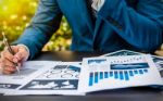 Handsome Businessman Wearing Suit And Using Modern Laptop Outdoo Stock Photo