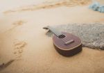 Ukulele On The Beach Stock Photo