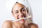 Pretty Young Woman Brushing Her Teeth Stock Photo