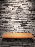 Wood Shelf On Stone Wall Stock Photo