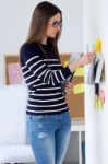 Confident Young Woman Working In Her Office Stock Photo