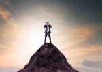 Business Man And Binocular Lens Standing On Top Of Mountain And Looking Through For Serching Stock Photo