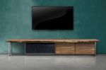 Led Tv On Concrete Wall With Wooden Furniture In Living Room Stock Photo