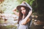 Beautiful Asian Woman Smiling Around The Nature Green And Water Stock Photo