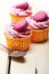 Pink Berry Cream Cupcake With Macaroon On Top Stock Photo