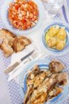 Grilled European Seabass With Potato And Tomato Salad Stock Photo