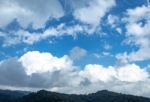 The Beauty Of The Sky When Light Hits The Clouds And Mountain Stock Photo