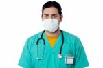 Doctor With Stethoscope And Face Mask Stock Photo