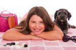 Girl In Swimsuit At The Beach With Dog Stock Photo