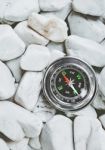 Compass On Pebbles Stock Photo