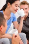 Asian Young Woman Drinking Coffee With Her Friends Stock Photo