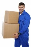 Young Man Carrying Cardboard Box Stock Photo