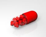 Red Pill Filled With Hearts Stock Photo