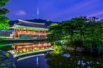 Namsangol Hannok Village And Seoul Tower Located On Namsan Mountain At Night In Seoul,south Korea Stock Photo