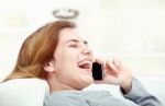 Woman Have Joyful Talk Over Phone Stock Photo