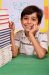 Young School Kid Smiling At Camera Stock Photo