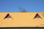 Gable On The Yellow Roof Look Like Smiling Eyes Stock Photo