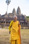 An Unidentified Old Buddhist Female Monk Dressed In Orange Toga Stock Photo