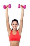 Happy Fitness Woman Lifting Dumbbells Stock Photo