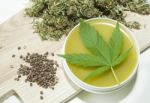 Cannabis Home Made Healing Ointment And Marijuana Green Leaf And Seeds Stock Photo