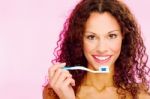 Smiling Woman And Teeth Brush Stock Photo