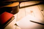 Guitar With Red Book And Pen On A Wooden Table, Vintage Style Stock Photo