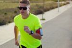 Handsome Young Man Running In The Park Stock Photo