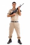 Standing Soldier Posing With Gun Stock Photo