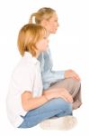 Mum And Son Sat On The Floor Smiling Isolated On White Backgroun Stock Photo