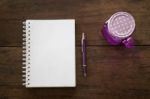 Notepaper, Pen And Drink On Wooden Table Stock Photo