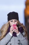 Attractive Young Stylish Blonde Girl Drinks Hot Drink From A Mug Stock Photo