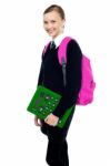 School Girl Posing With Backpack And Calculator Stock Photo