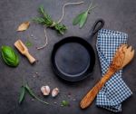 Empty Old Cast Iron Skille On Dark Stone Background. Ingredients Stock Photo